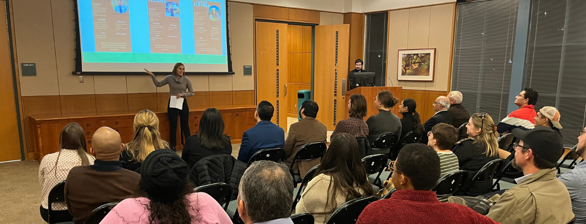 Student presenting to a group of people